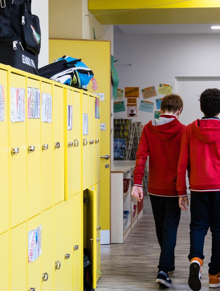 students walking in school hallway