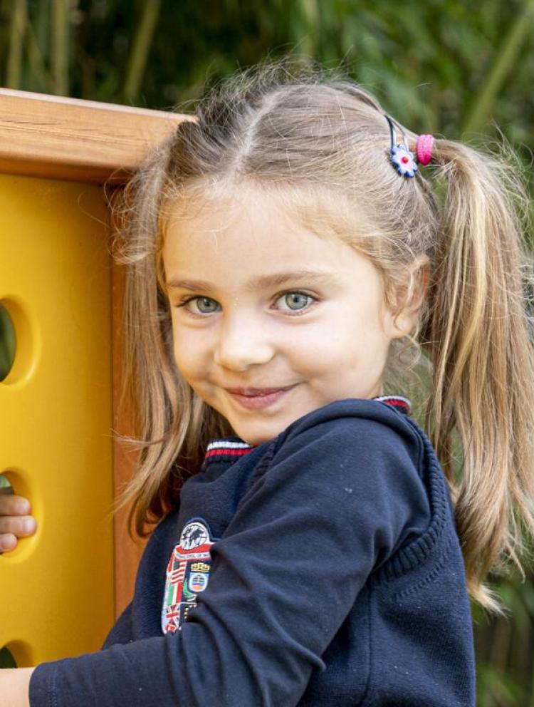 kindergarten student playing games outdoors
