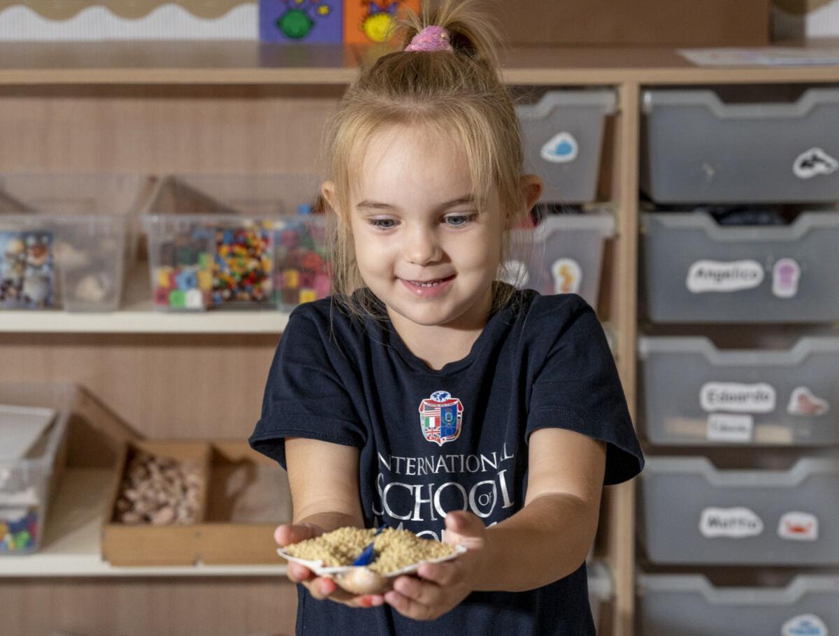 kindergarten student looking happy in class