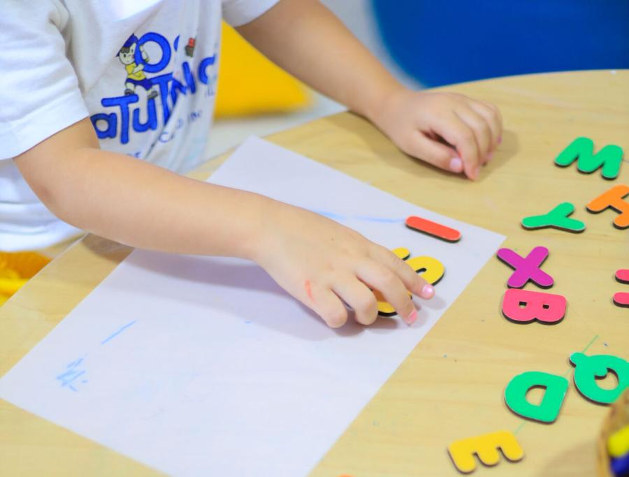 child-playing_with_alphabet