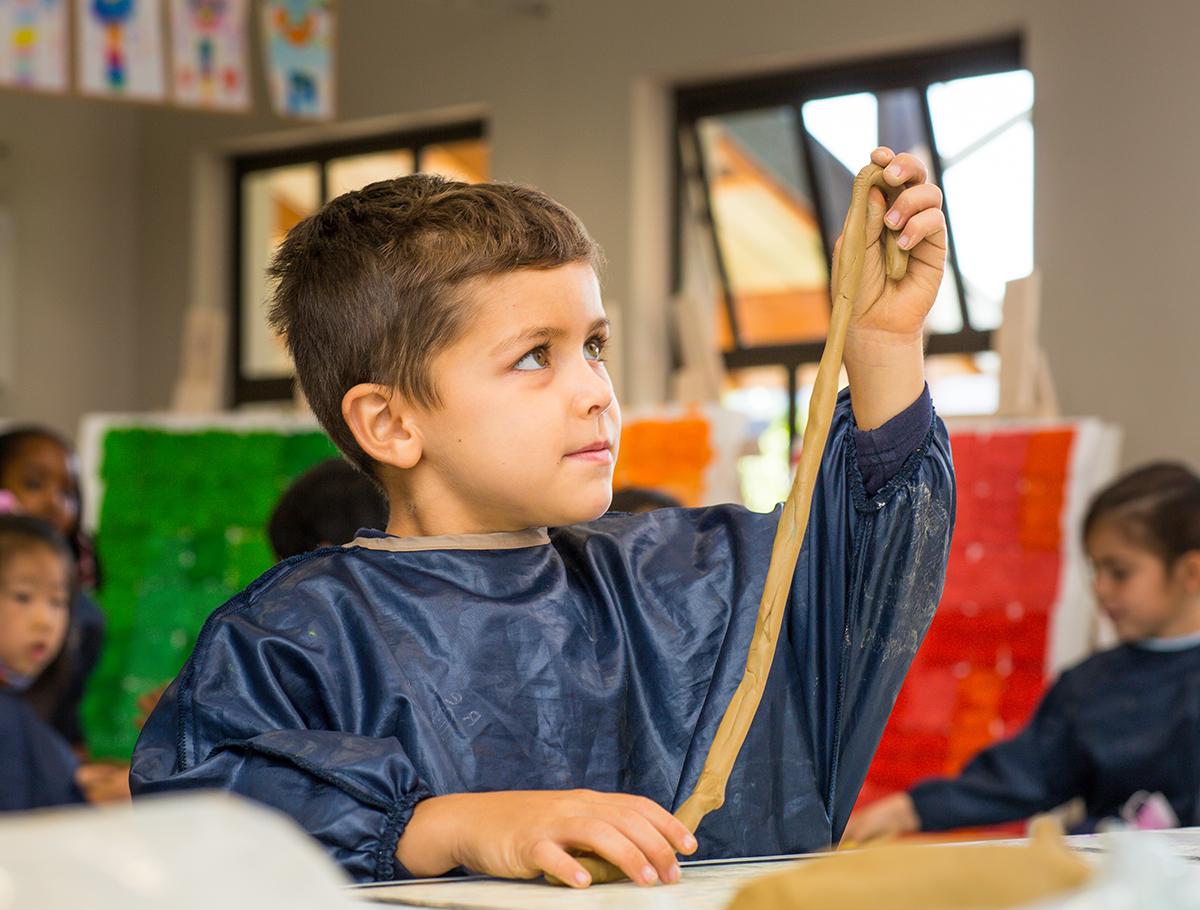 Boy playing with playdough
