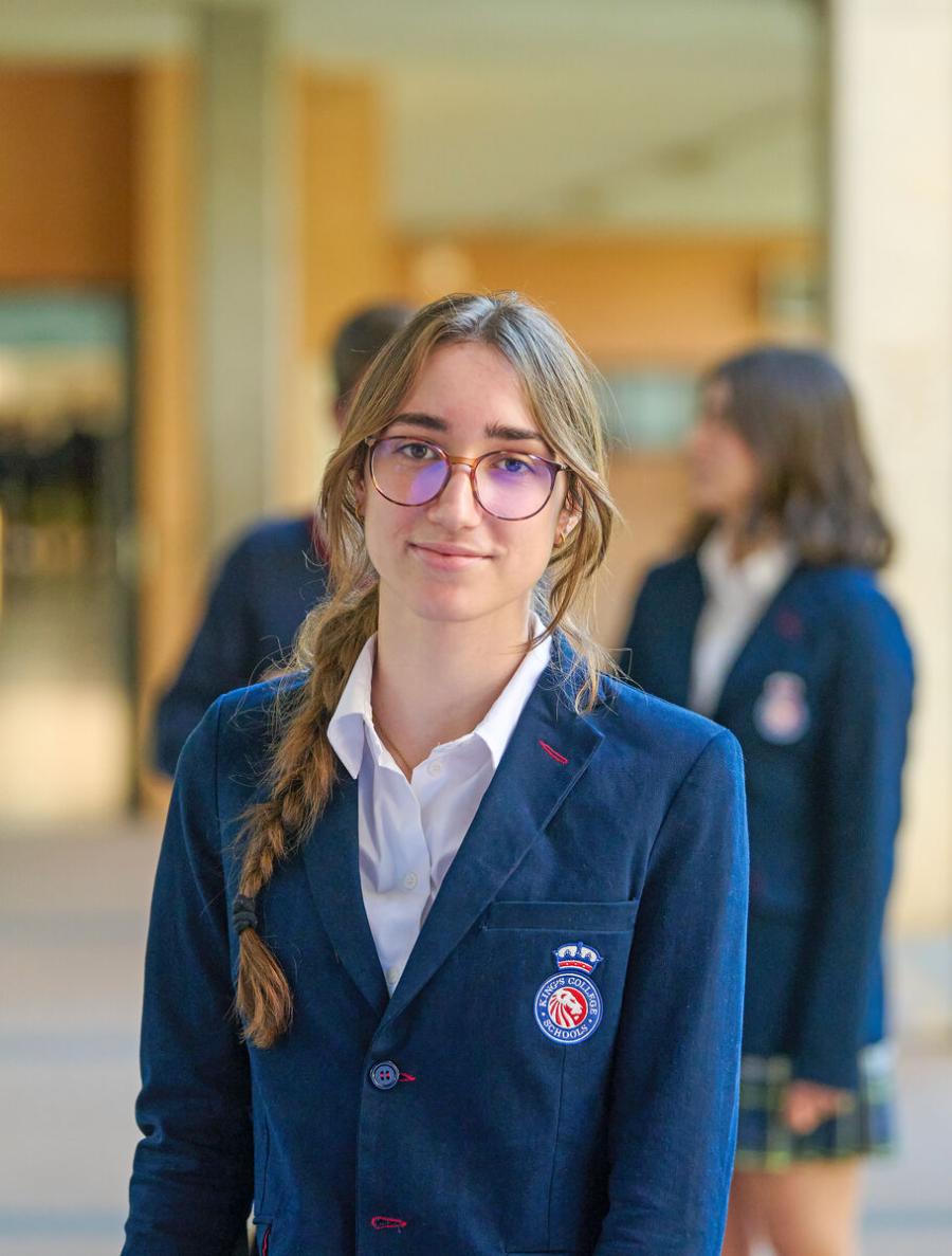 Secondary School student in King's College, Alicante uniform on campus