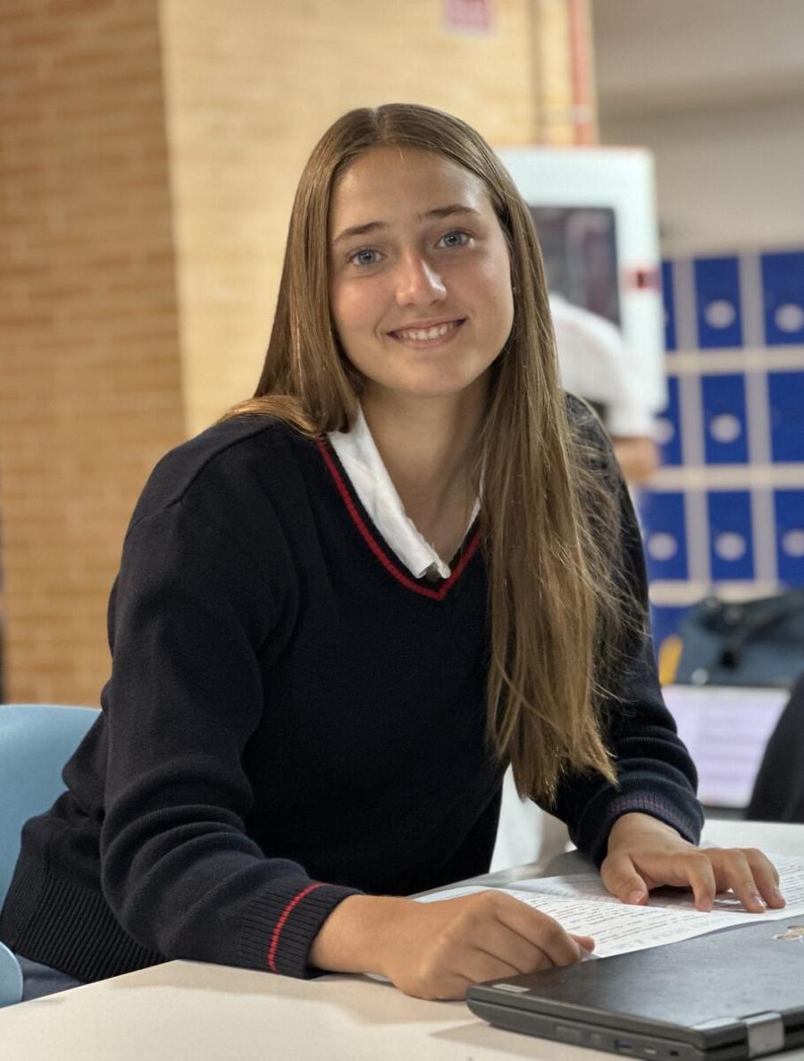 IB Diploma Programme student working on a laptop at King's College, Alicante