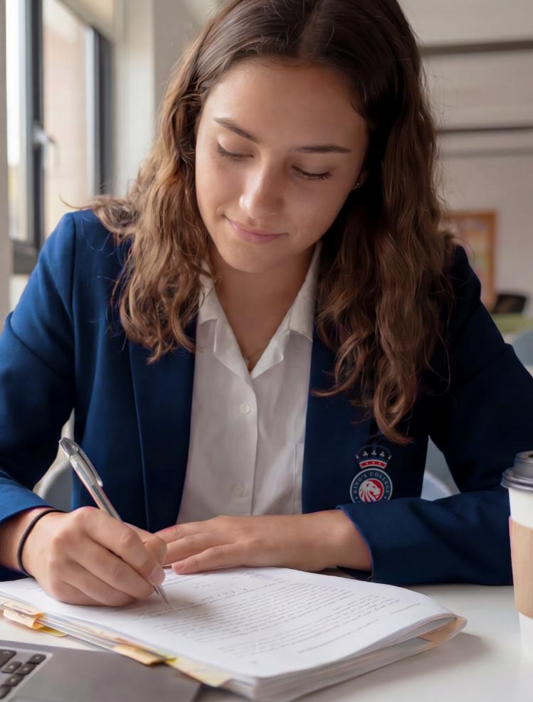 IGCSE student writing in class at King's College, Alicante