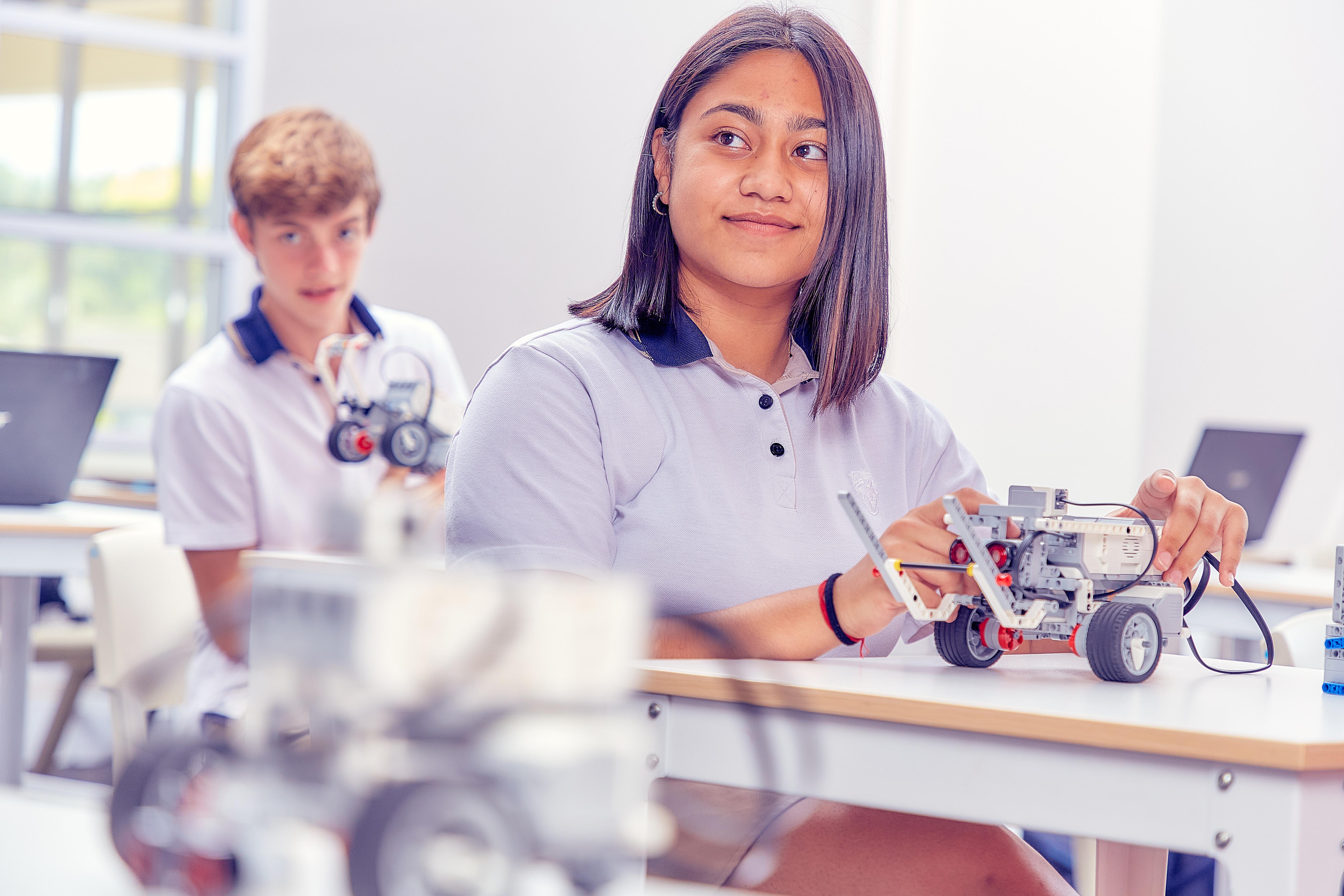 Student building a mechanica component