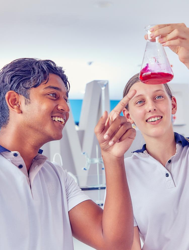 Boy and Girl carrying out experiment