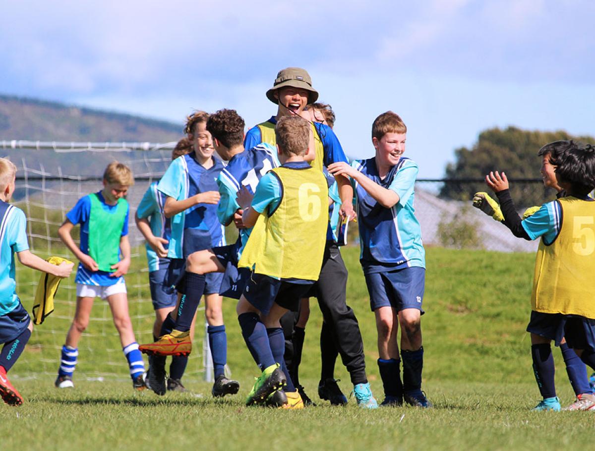 Ethan Foo with his AIMS Games team