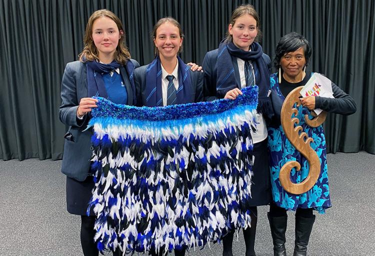Members of the Premier Girls Netball team with departing coach Kim Falwasser