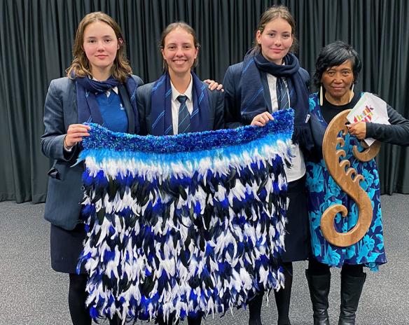 Members of the Premier Girls Netball team with departing coach Kim Falwasser