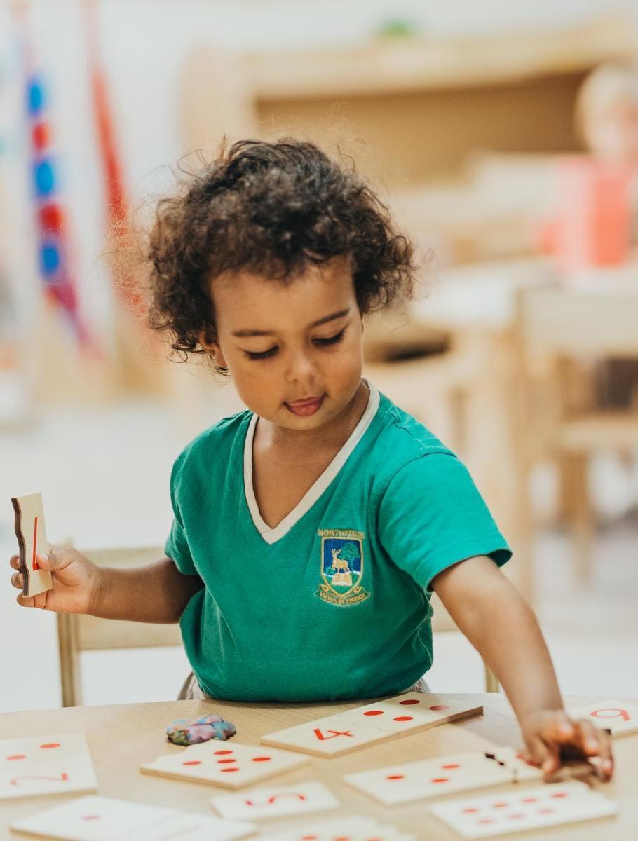 Northfileds Pre-nursery student playing with numbers