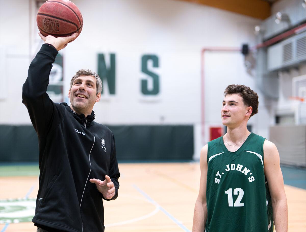 student_and_coach_at_the_basket_ball_court