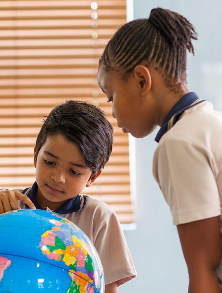 our-school-giving-back-students-globe.jpg