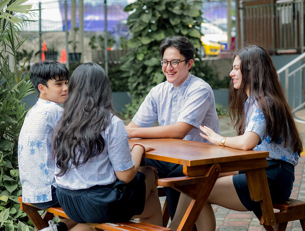 students-outside-bench