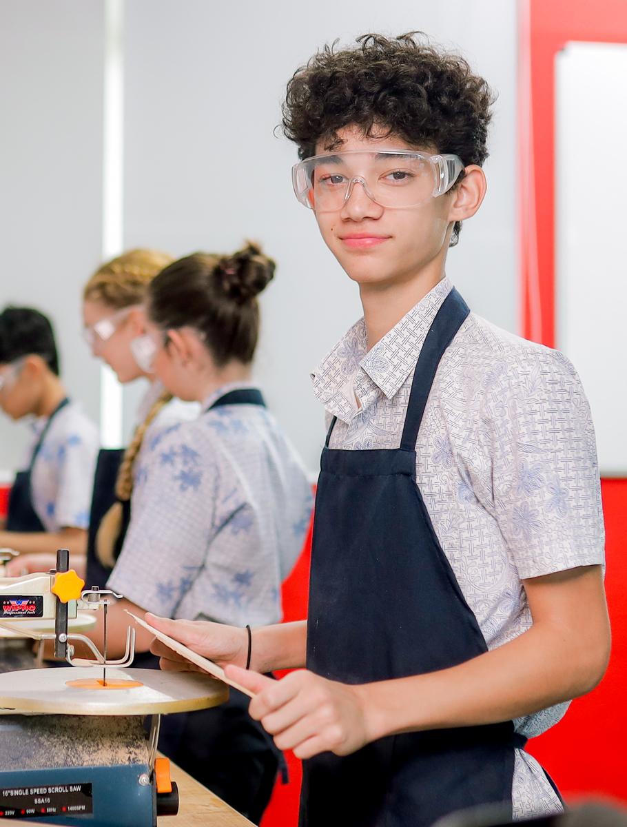 Student using carpentry tools
