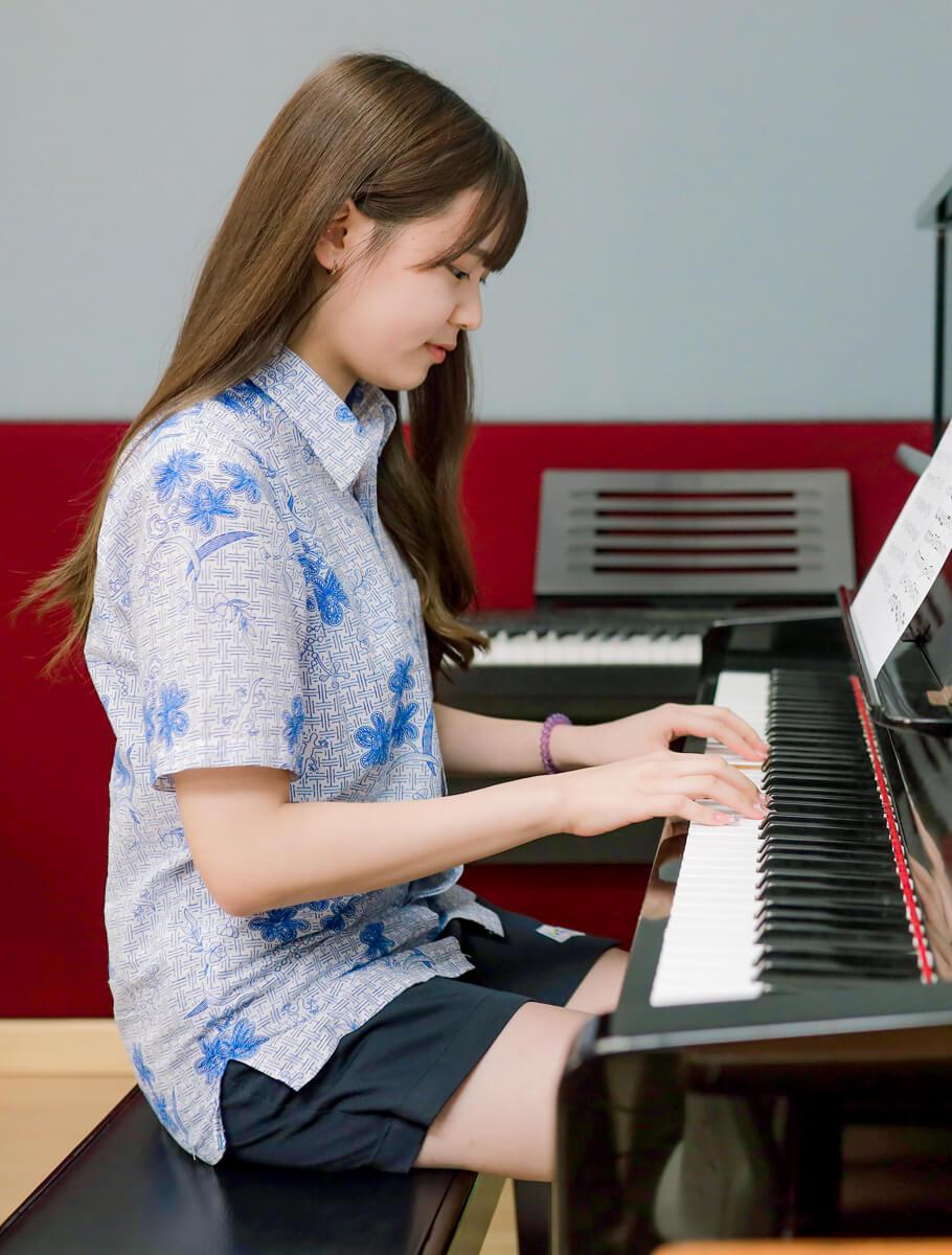 Student playing piano