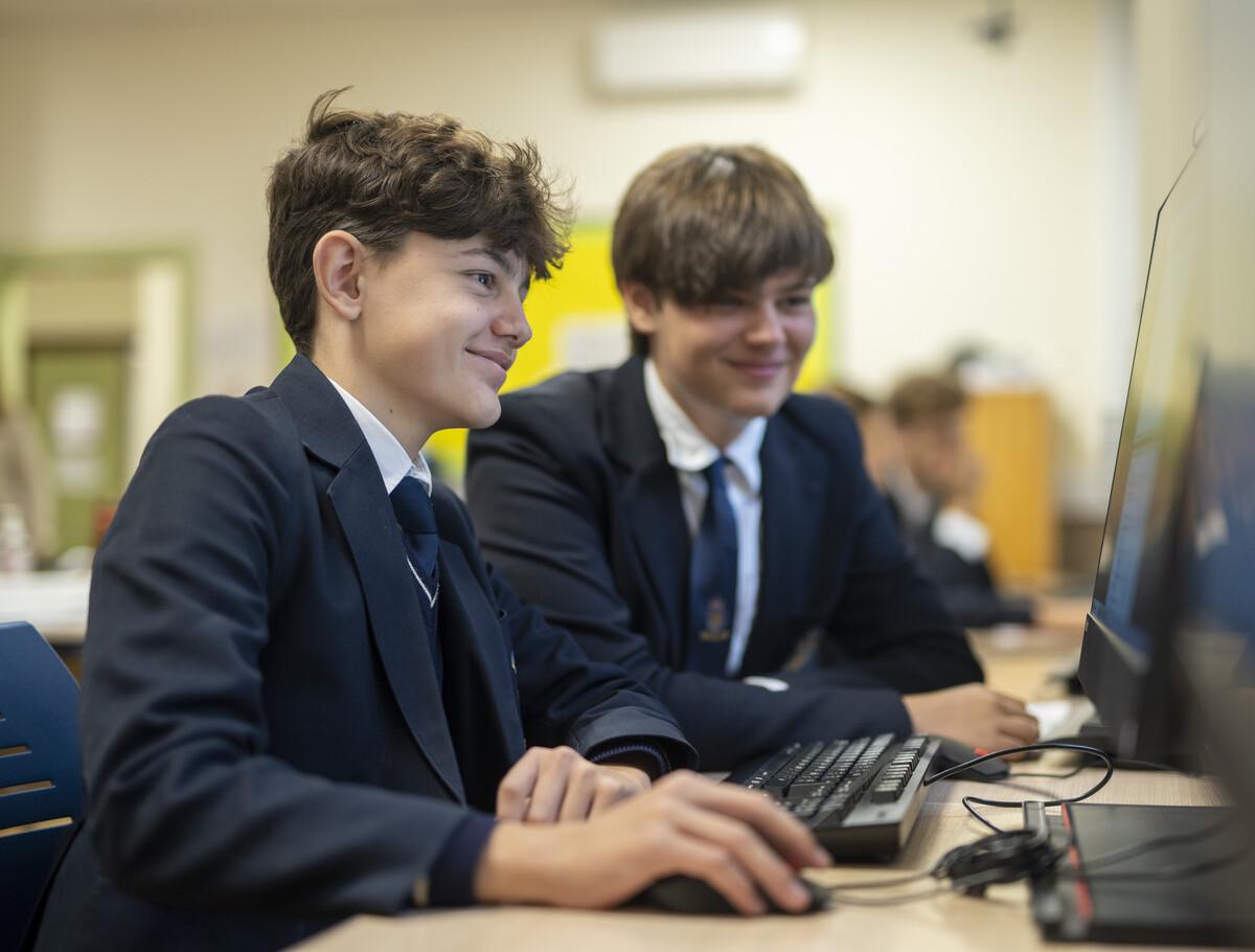 KC Soto two students learning on a computer