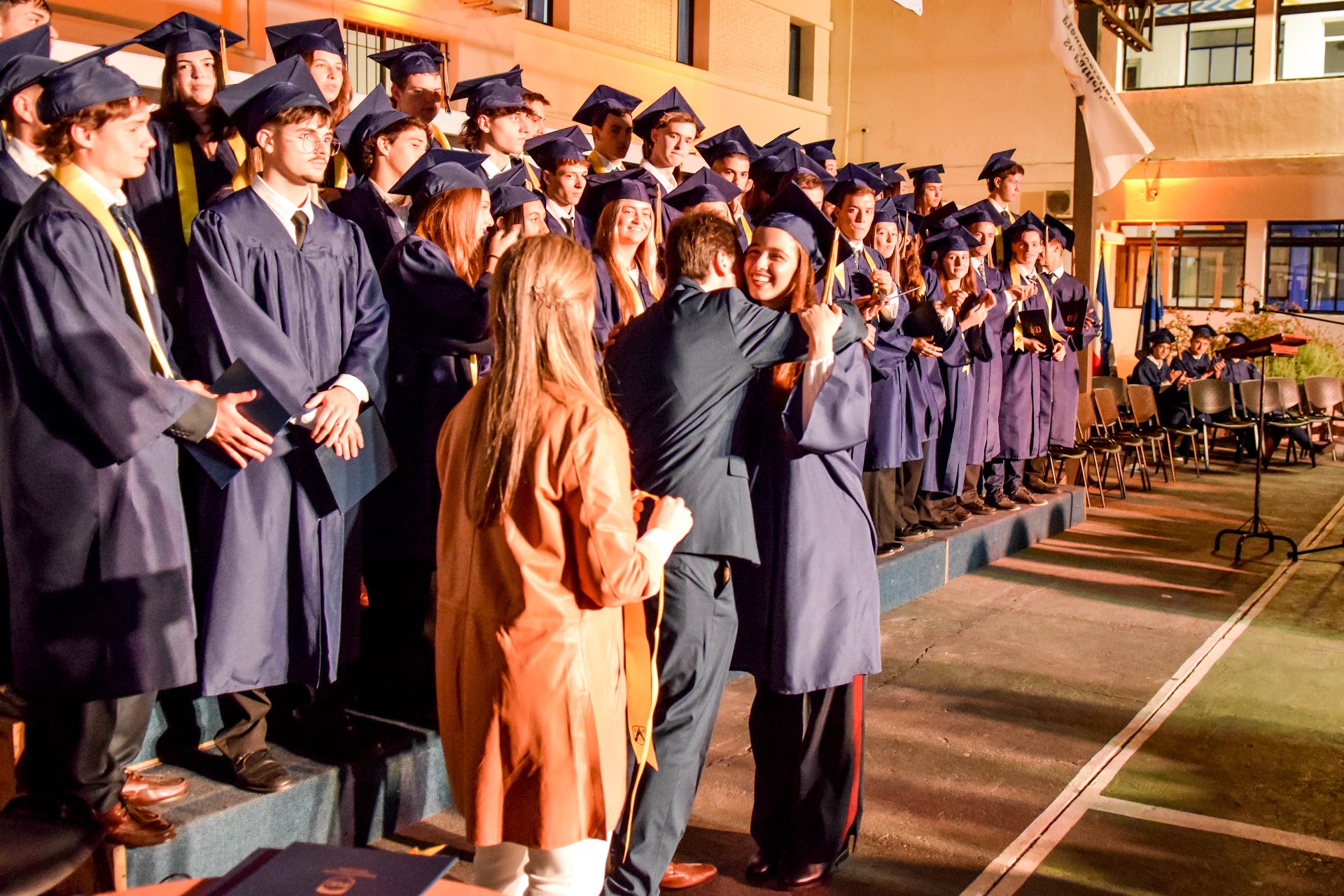 parents and graduates on stage