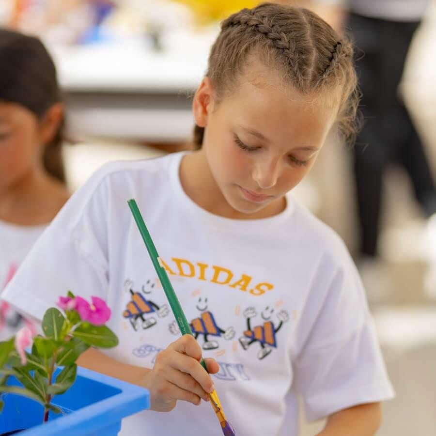 Student painting flowers