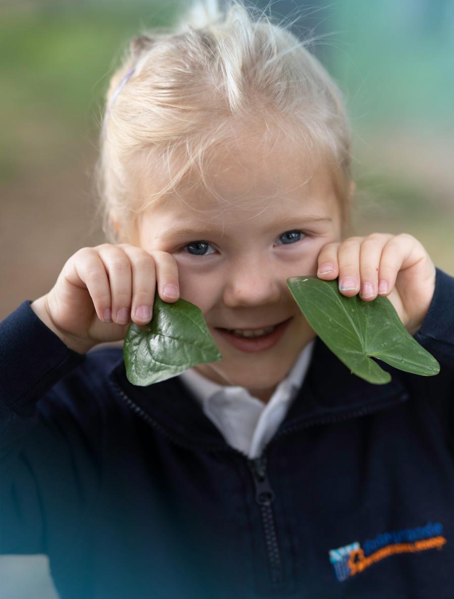 Student with leaves