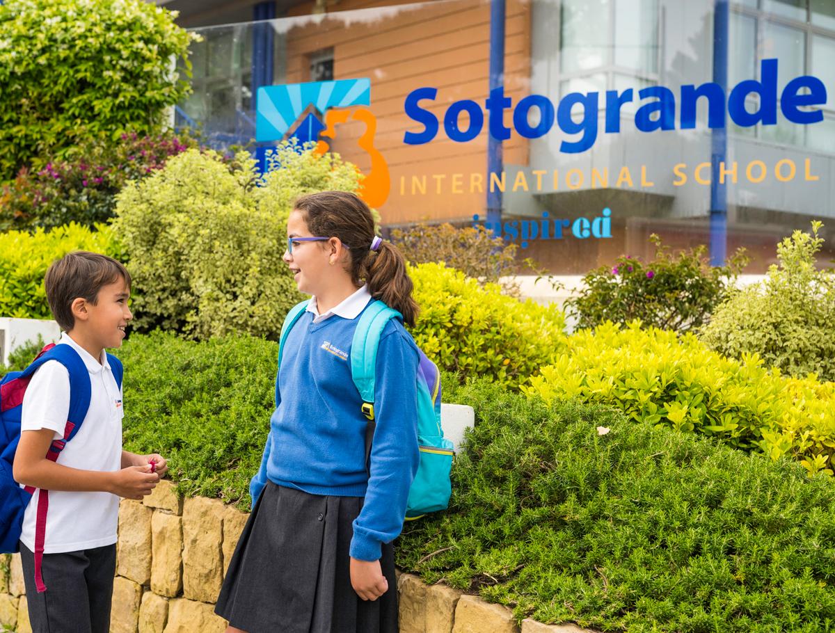 Students standing outside campus