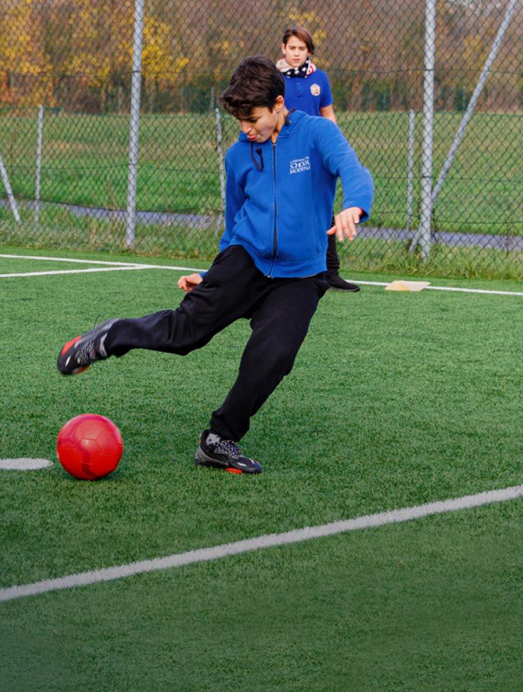 Campus-facilities-boy-kicking-ball