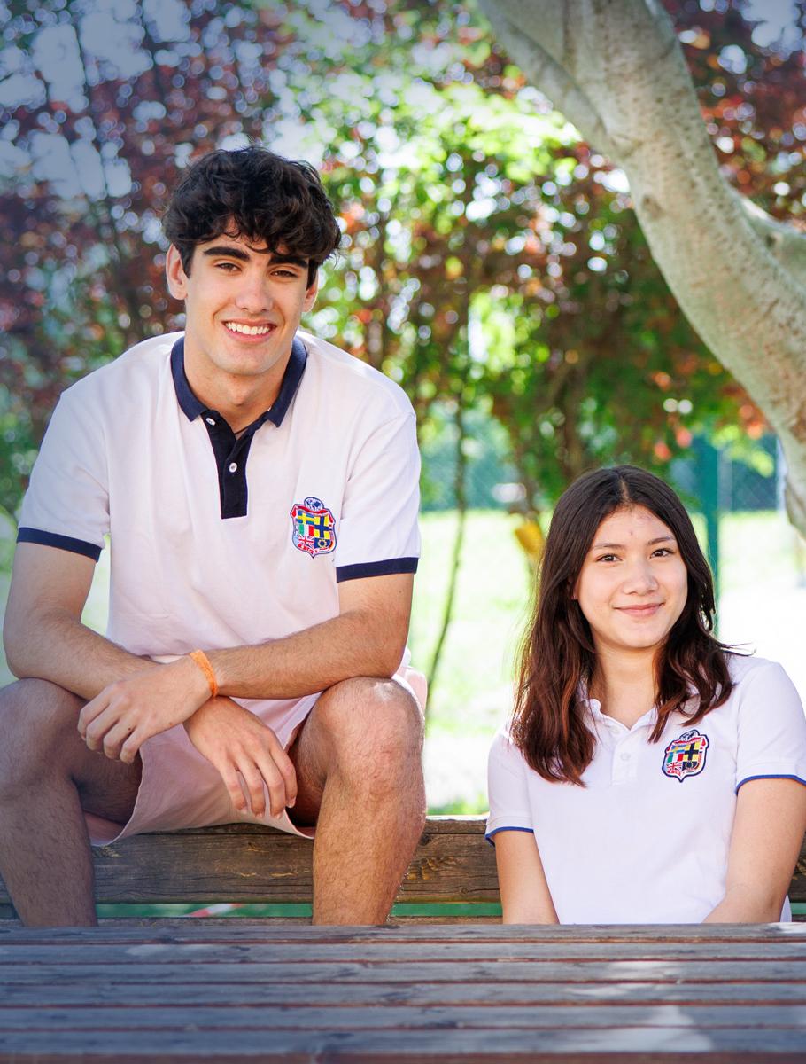 students-sitting-on-bench-under-tree