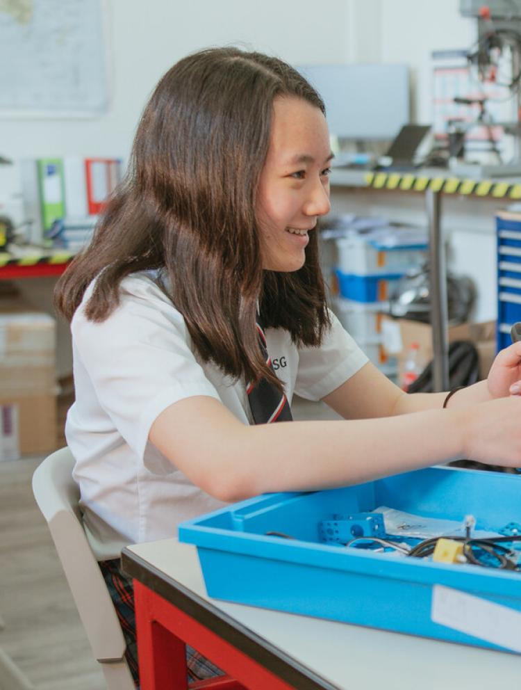 high school students working on group project