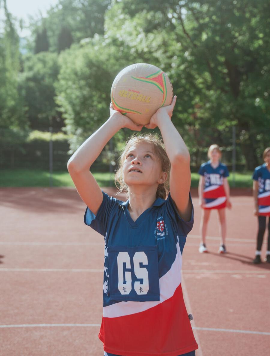 student playing sport outside