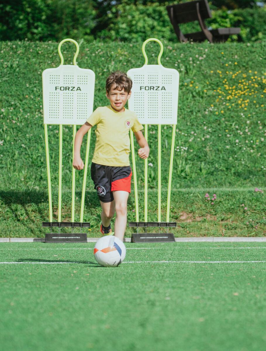 school student playing football