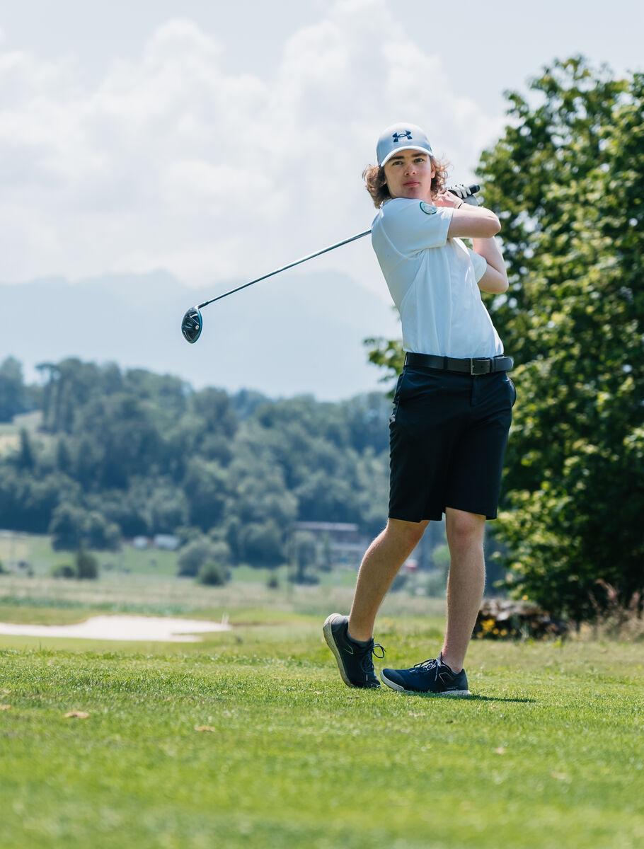 Secondary School student playing golf