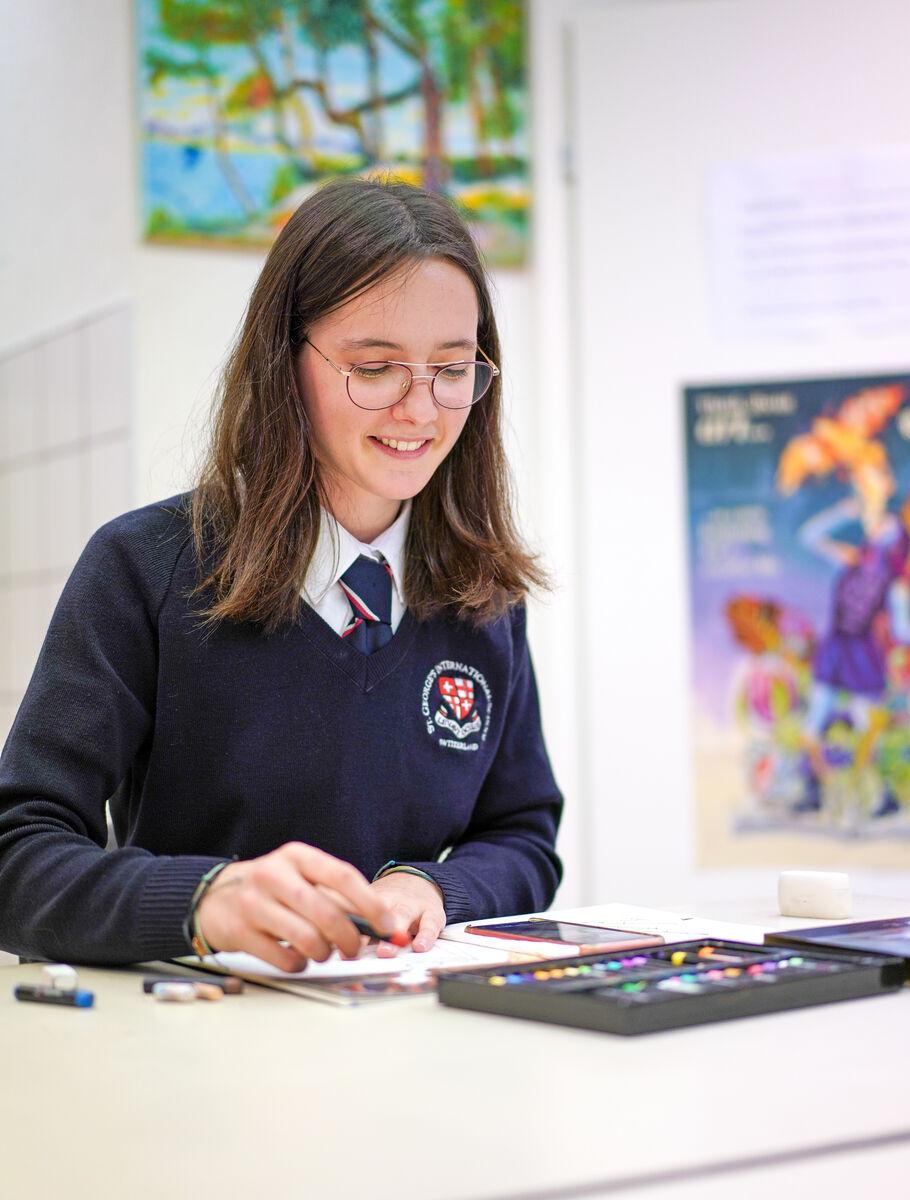 middle school student enjoying arts and crafts lesson