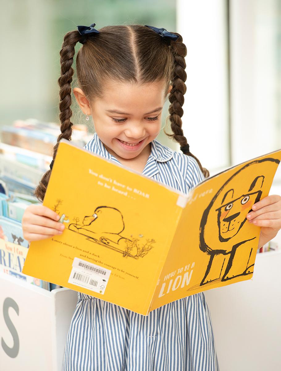 girl-reading-smiling